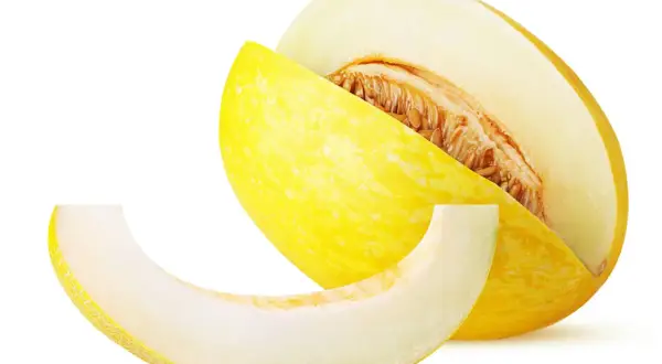 En saftig honungsmelon, skuren för att visa dess frön. Perfekt för en lätt och hälsosam snack med lågt honungsmelon kcal-innehåll.